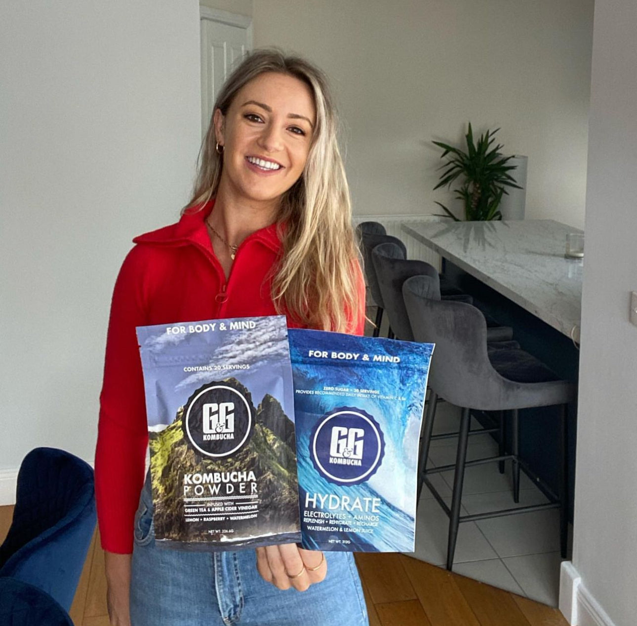 Clodagh holding G&G hydrate and kombucha products